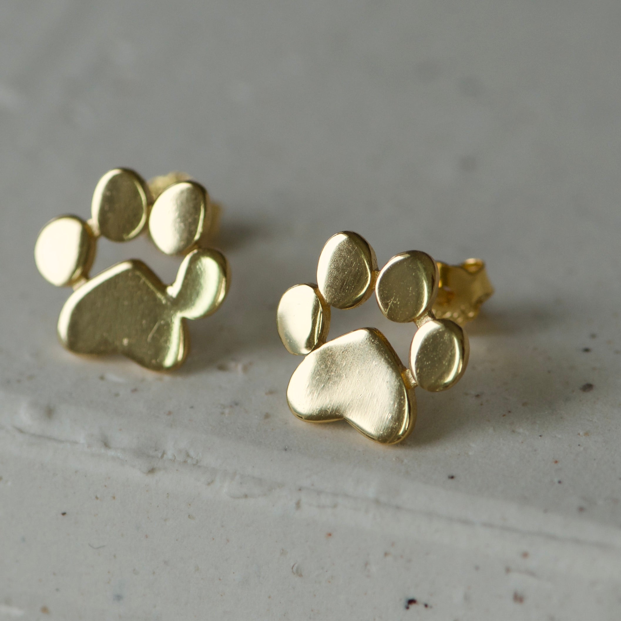 Gold Dog paw stud earrings